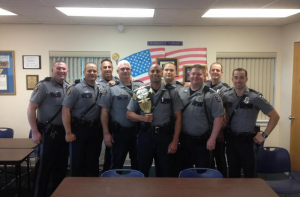 Surrounded by his fellow Manchester Township Police Officers, Patrolman Michael Terranova, center, poses with his “Public Safety Fight Night” trophy. (From left to right): Officer Scott Thompson, Officer Richard Chevrier, Sgt. Sal Ventre, Officer Thomas O’Hare, Officer Michael Terranova, Officer George Smith, Officer Rich Conklin, Officer Thomas Chant and Officer Kyle Rickvalsky.